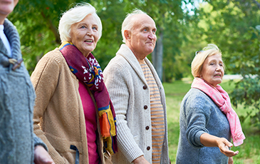 residents walking in a garden