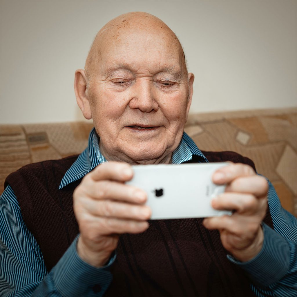 old man using a phone