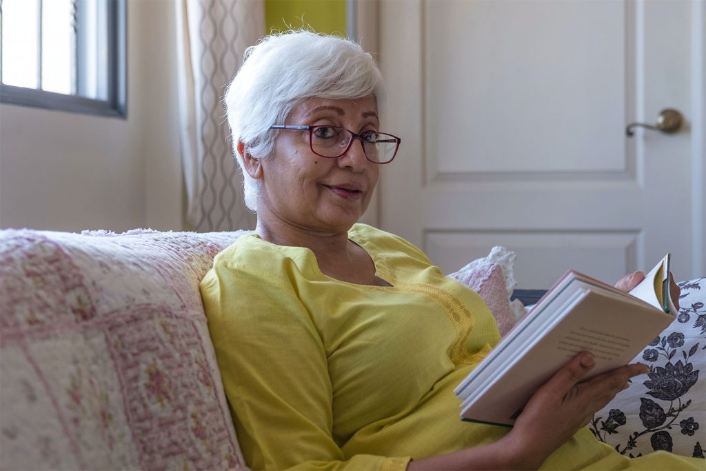 old lady holding a book