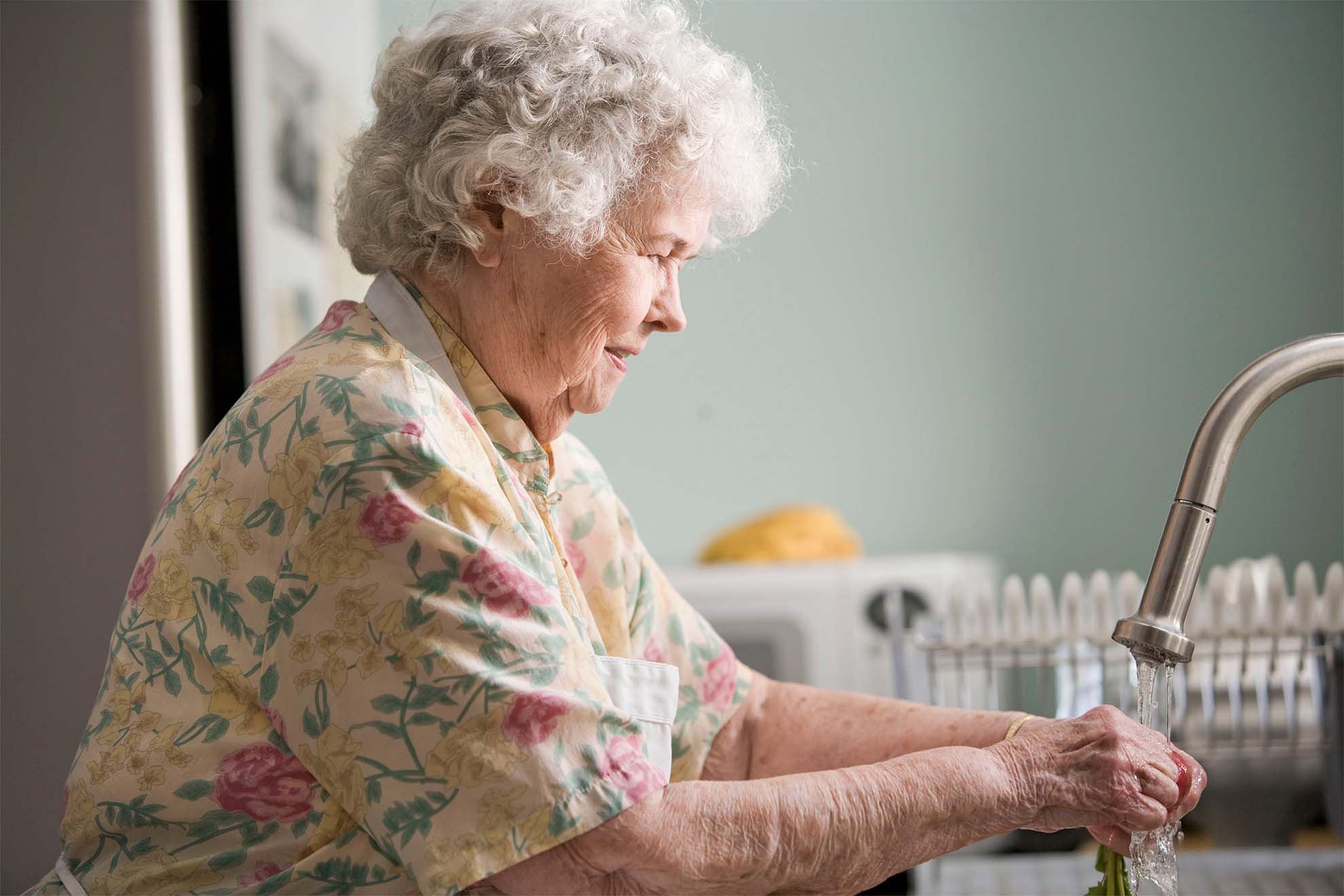 old lady washing the dishes