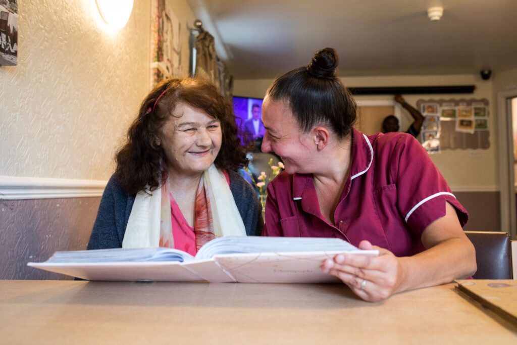 resident with staff at barton house